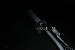 Close-up of a 79BIKE Falcon Pro Electric Dirt Bicycle handlebar with black background