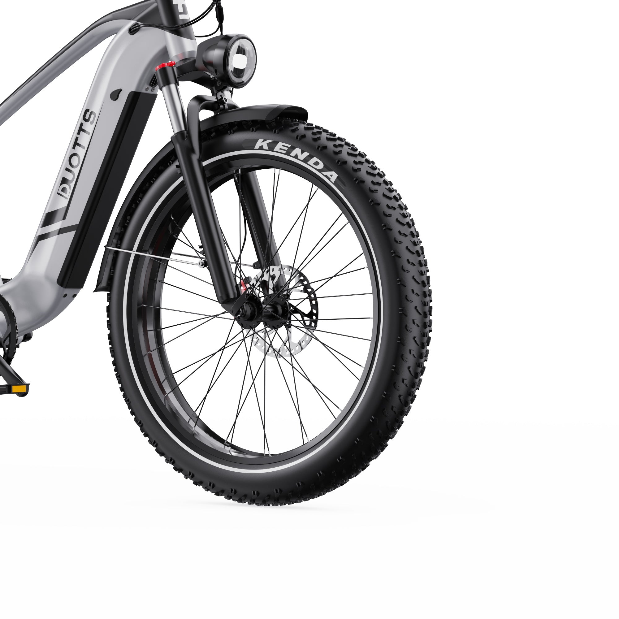 Close-up of a f26 Lite bicycle wheel with Kenda tire on a white background