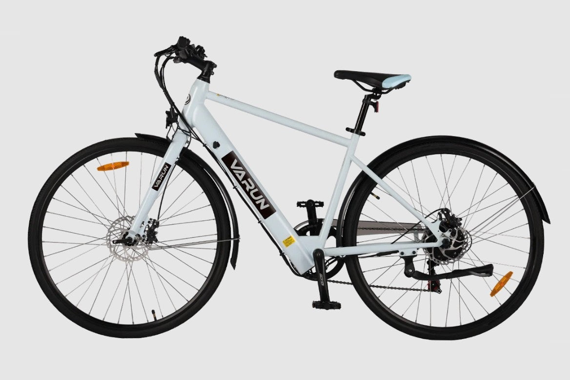 White VARUN C7007 Premium Commuter Electric Bicycle with black wheels on a light gray background