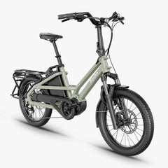 A 27.5-inch FIIDO T31 folding electric bicycle in a muted sage green frame with black components, including the seat, handlebars, tires, and battery pack, shown on a light gray background.